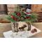This shows a handmade wooded box that has a moose and pine trees wood-burned on the front. The box hold a Christmas greenery arrangment. 